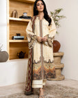 Woman in a traditional outfit standing in a room with wooden shelves and decor.