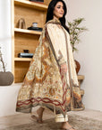 Woman in a traditional outfit standing in a room with wooden shelves and decor.